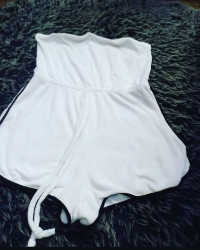 White romper with black lining